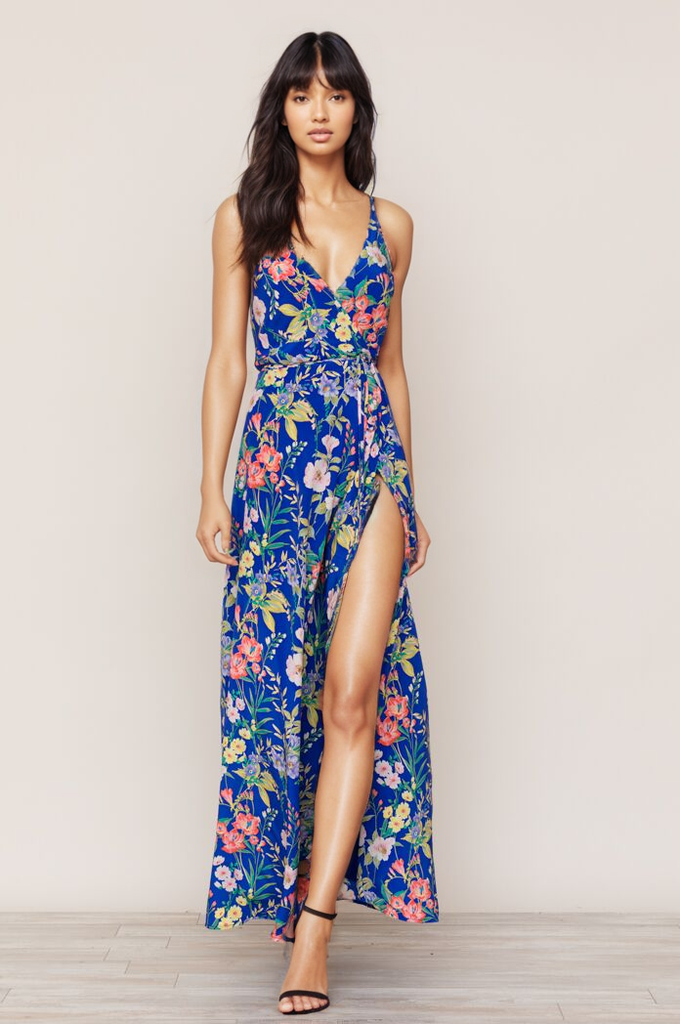 Yumi Kim's flowing Rush Hour Silk Maxi Dress is your new go-to from weddings to running around the city. The blue floral dress includes a crossover bodice with deep v-neckline.